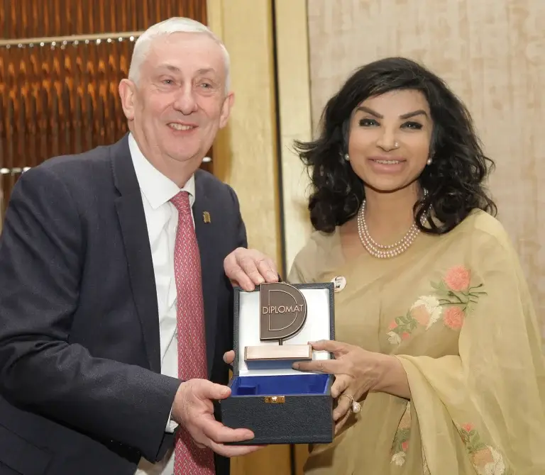 Speaker of the House of Commons Rt Hon Sir Lindsay Hoyle presents the award to High Commissioner of Bangladesh Saida Muna Tasneem